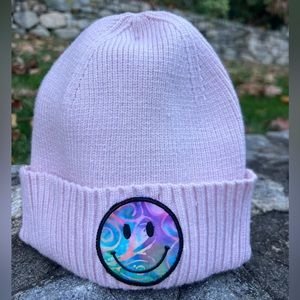 Pink beanie hat with handmade smile patch. Never worn.